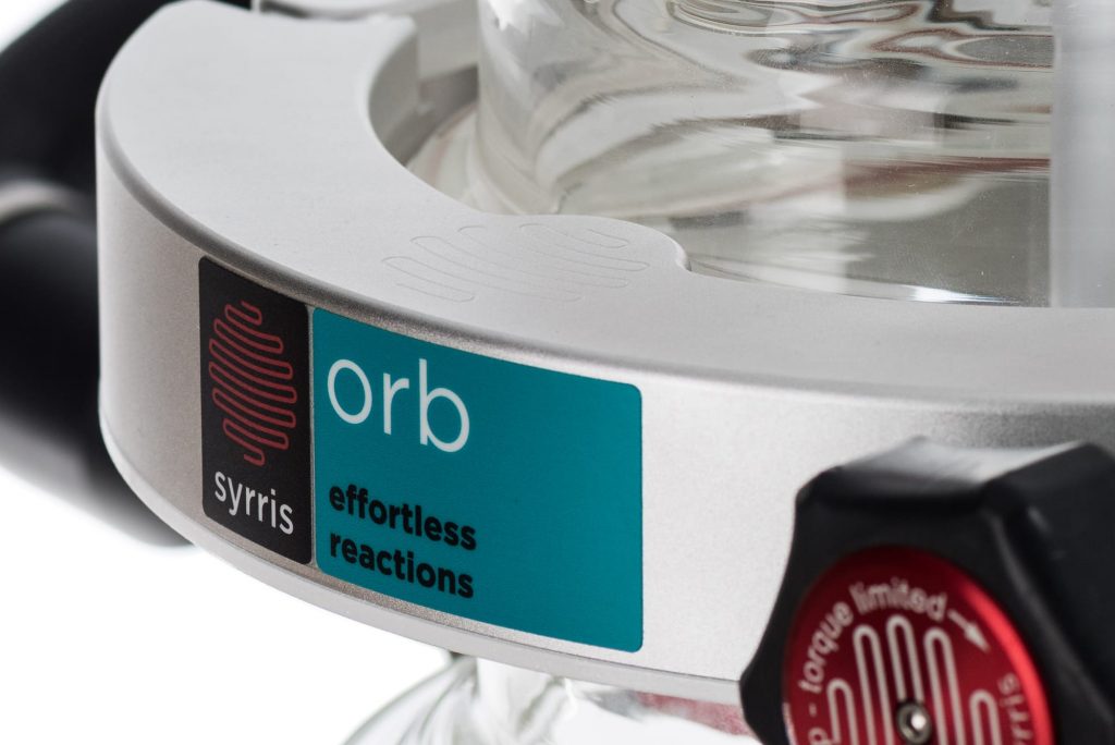 A close up photograph of the Syrris Orb label on the Orb's quick clamp